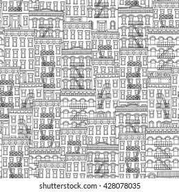 Seamless pattern of New York style houses with fire escape stairs, hand drawn ink illustration