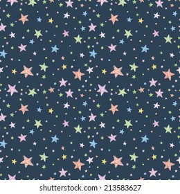 Seamless pattern with night sky and colorful hand drawn doodle stars. Vector tiling background.