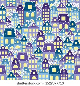 Seamless pattern with a night winter town under the snow with lighting windows