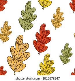 Seamless pattern with oak leaves . Red, yellow and green painted leaves on a white background. Vector illustration