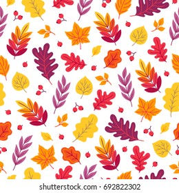 Seamless pattern with oak, maple, rowan leaves and berries on white background. Perfect for wallpaper, gift paper, autumn greeting cards.