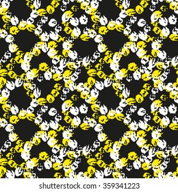 seamless pattern ofwhite and yellow brush strokes arranged in a circle on a black background