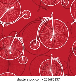 Seamless pattern with old-styled bicycles on a red background