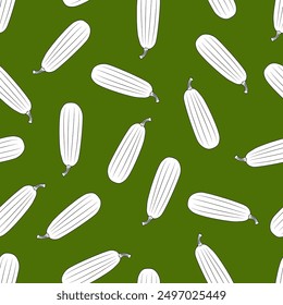 Seamless pattern on a green background featuring black and white courgettes.