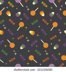 Seamless pattern on Halloween dark background: candy, lollipop on a stick, stars. Flat style vector image.