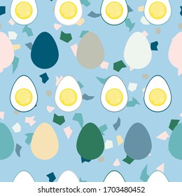 seamless pattern on a light blue background with multi-colored eggs and egg halves and multi-colored shells