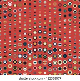 Seamless pattern on red background. Consists of geometric elements of round shape in color. Useful as design element for texture, pattern and artistic compositions.