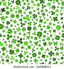 Seamless pattern on St. Patrick's Day made of clover leaves in green colors