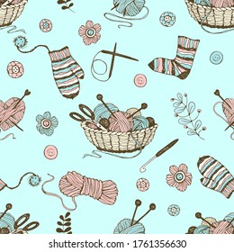 Seamless pattern on the theme of knitting with a basket and balls of yarn on a turquoise background. Vector.