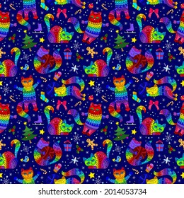 Seamless pattern on the theme of new year and Christmas with bright cats and toys on a blue background