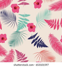 Seamless pattern on a tropical theme. Fern, leaves of palm trees, hibiscus flower. Vector.