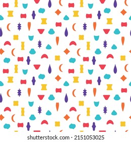 Seamless pattern on white background. Endless backdrop from isolated multicolored abstract shapes. Template for design of fabric or kids wallpapers.