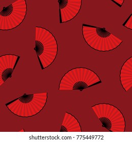 seamless pattern of an open traditional Japanese fan on a red ba