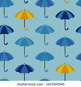 Seamless pattern with open umbrellas. Rows of umbrellas in shades of blue and sometimes yellow. Vector illustration, flat cartoon design. Umbrella with rounded handle. Texture for fabric, baby clothes