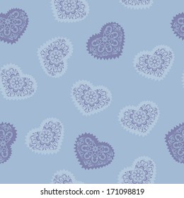 Seamless pattern with openwork hearts in shades of blue. Can be used as a card for Valentine's Day and background.