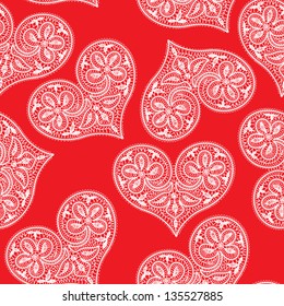 seamless pattern of openwork lace white heart on a red background