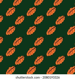 Seamless pattern of orange autumn leaves on green background. Vector illustration can be used as design element on thematic sites and products of background image for printing on fabric or stationery.