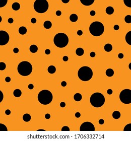 Seamless pattern. Orange background with black circles . Vector illustration.