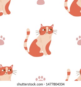 Seamless pattern. Orange cat and paws. Good for textile and wrapping paper