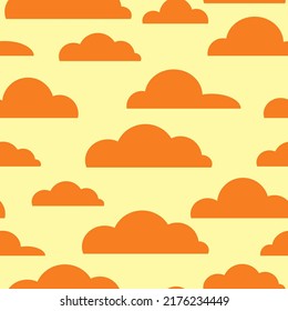 Seamless pattern with orange clouds on a yellow background