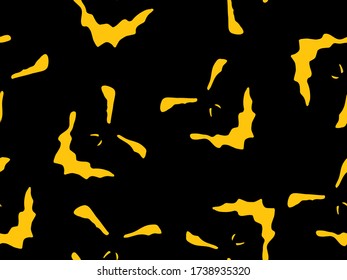 Seamless pattern with orange halloween carved face silhouettes on black background. Can be used for scrapbook digital paper, textile print, page fill. Halloween vector illustration