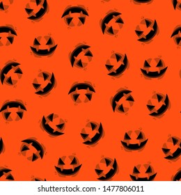Seamless pattern with orange halloween pumpkin carved faces. Vector october party background. Can be used for scrapbook, wallpaper, textile print, page fill. Vector illustration.