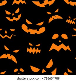 Seamless pattern with orange halloween pumpkins carved faces silhouettes on black background. Can be used for scrapbook digital paper, textile print, page fill. Vector illustration