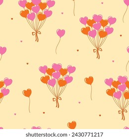 Seamless pattern of orange and pink heart-shaped balloons. Vector graphics.