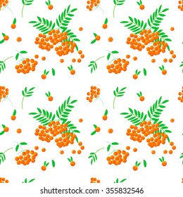 Seamless pattern with orange rowan berries and green leaves on a white background. Vector.