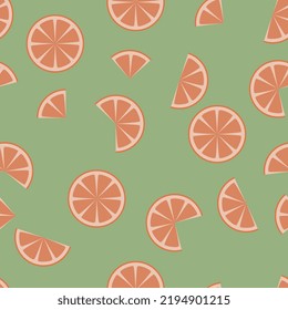 A seamless pattern of orange slices on a green background