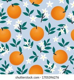 Seamless pattern of oranges, flowers and leaves on blue. Fruit vector background