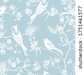 Seamless pattern in oriental style with blooming branches trees and birds. Wildlife silhouette, white floral ornament on blue background. Vector hand drawn illustration, garden in japanese style.
