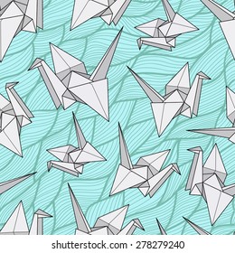 Seamless pattern with origami cranes. Paper crane on the abstract blue waves background.