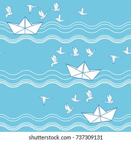 Seamless pattern with origami paper boats and seagull. Cute Marine pattern for fabric, baby clothes, background, textile, wrapping paper and other decoration.Vector illustration.