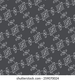 Seamless pattern. Ornament of fine lines and curls in gray tones.