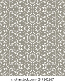 Seamless pattern. Ornament of  lines and curls in gray tones.