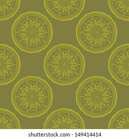 Seamless pattern with ornamental circles in green and yellow colors