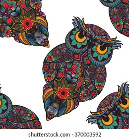 Seamless pattern from ornamental color owl with flowers and mandala. African, indian, totem, tattoo. It may be used for design of a t-shirt, bag, postcard, a poster and so on.