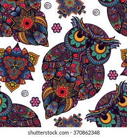 Seamless pattern from ornamental color owl with flowers and mandala. African, indian, totem, tattoo. It may be used for design of a t-shirt, bag, postcard, a poster and so on.