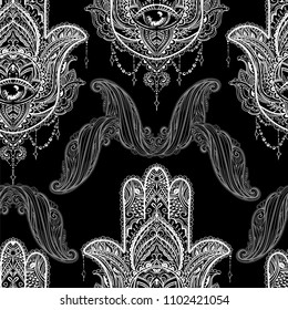 Seamless pattern from ornate amulet Hamsa Hand of Fatima. Ethnic amulet common in Indian, Arabic and Jewish cultures.