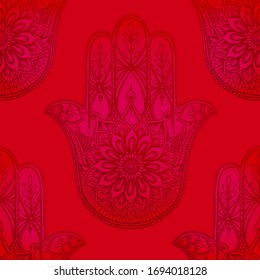 Seamless pattern with ornate hand drawn hamsa. Popular Arabic and Jewish amulet. Vector illustration. Vector illustration in red.