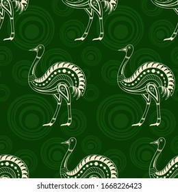 Seamless pattern of ostrichs silhouettes with abstract circles on green background. Australian art. Aboriginal painting style. Vector color background.