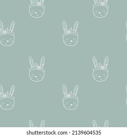 Seamless pattern with outline bunny on blue background. Spring digital background with vector hand drawn elements. Seamless pattern for kids fabric, textile and scrapbook paper.