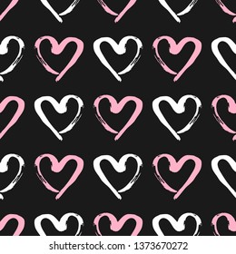 Seamless pattern with outlines of hearts drawn by hand with a rough brush. 