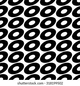 Seamless pattern with ovals, ellipses. Black and white abstract background with tilted oval shapes.