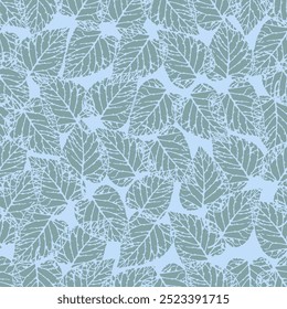 Seamless pattern of overlapping green leaf on light blue background. Presented through the arrangement of leaf close together to form a single wall. The pattern is ideal for printing on fabric,textile