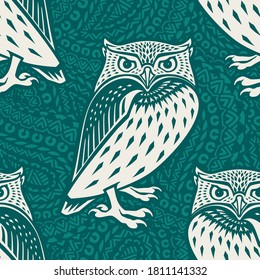 Seamless pattern with an owl in ethnic style. Vector illustration.