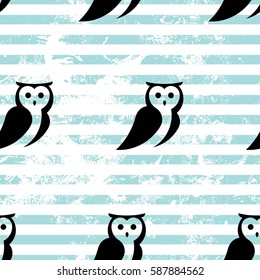 Seamless pattern with owls and blue stripes.