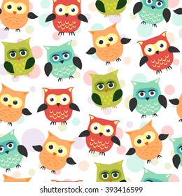 Seamless pattern with owls in cartoon style