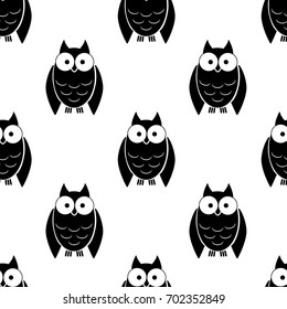 Seamless pattern with owls in cartoon style
